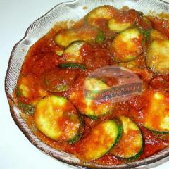 Appetizer with zucchini in tomato sauce and pepper